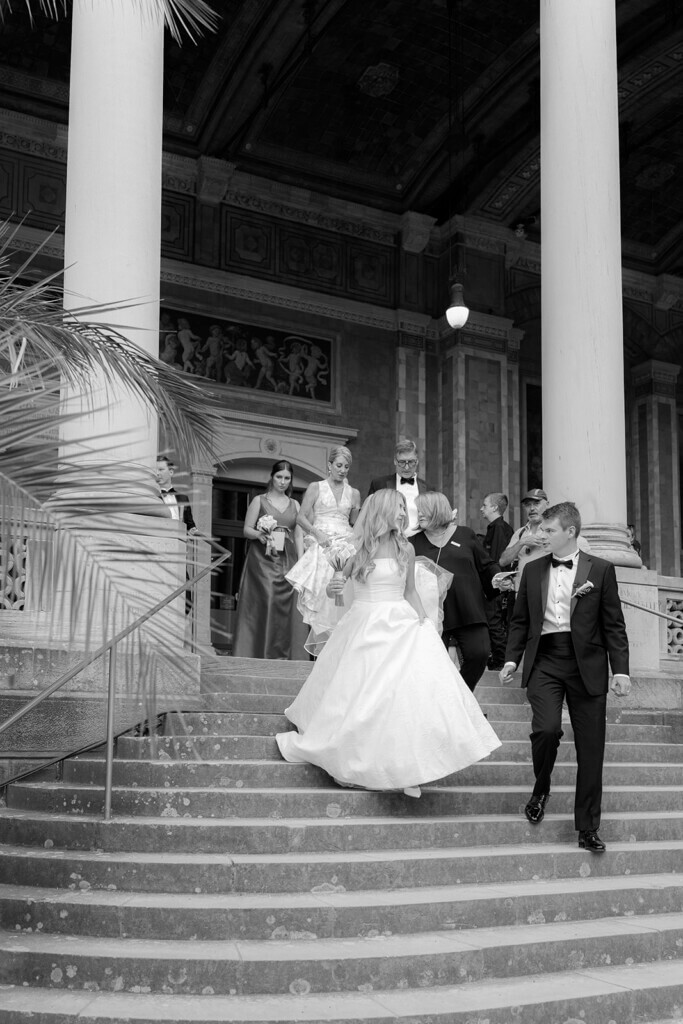 bridal couple walking down the stairs after their free ceremony
