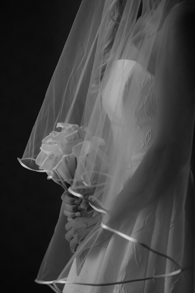 bridal detail. holding flower bouquet